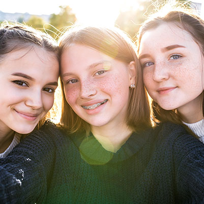 three girls smiling